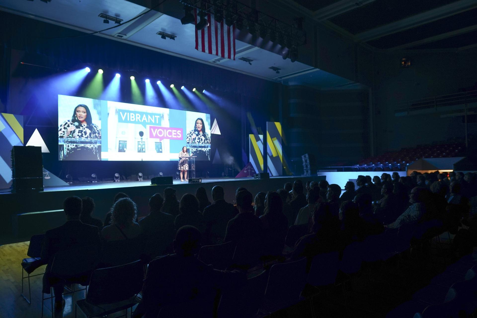Corporate event stage setup with blue lighting